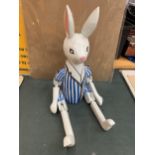 A WOODEN PAINTED SHELF PUPPET