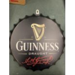 A RETRO GUINNESS HANGING WALL BOTTLE TOP DISPLAY SIGN 35CM