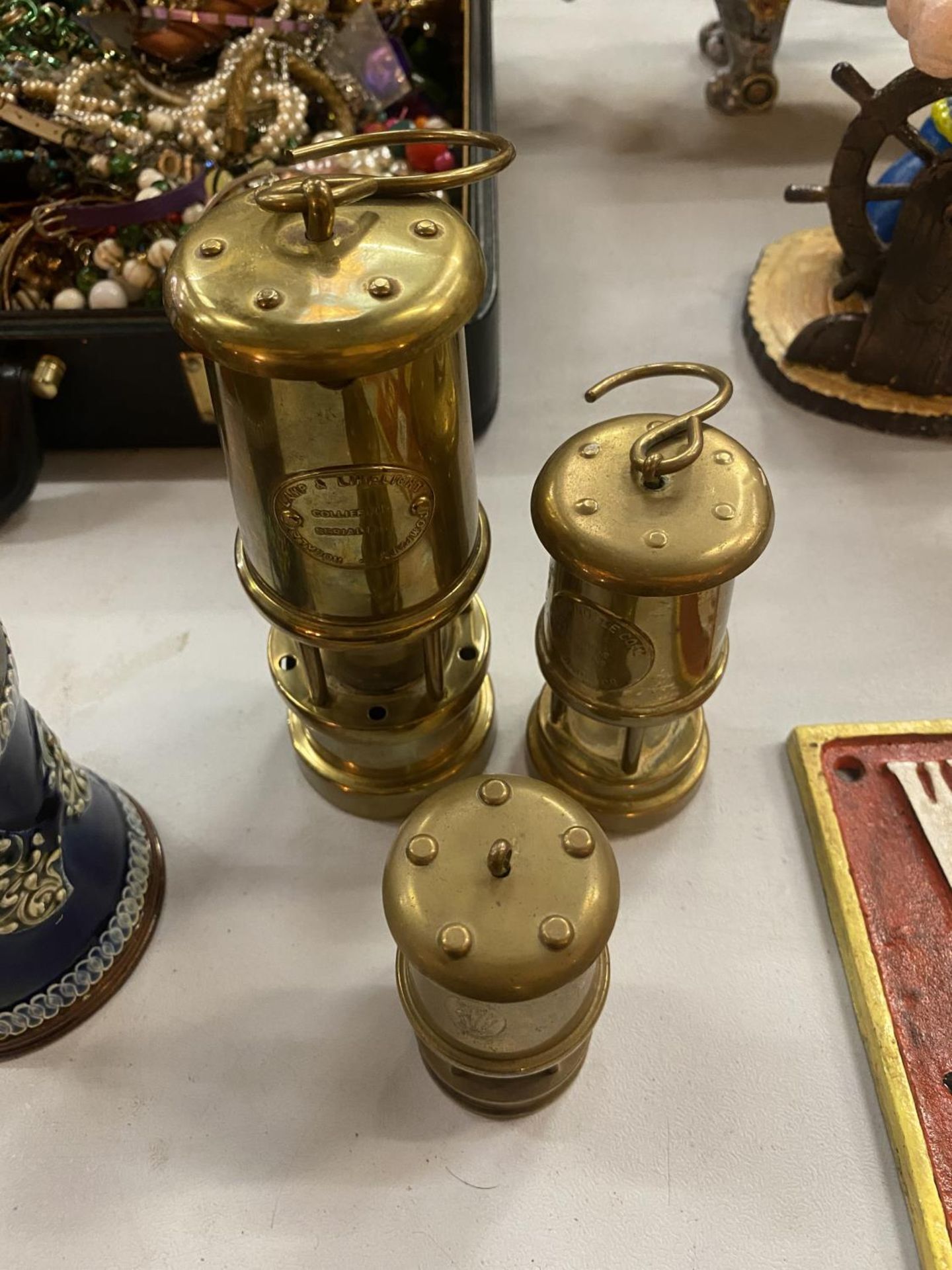 THREE BRASS MINERS LAMPS