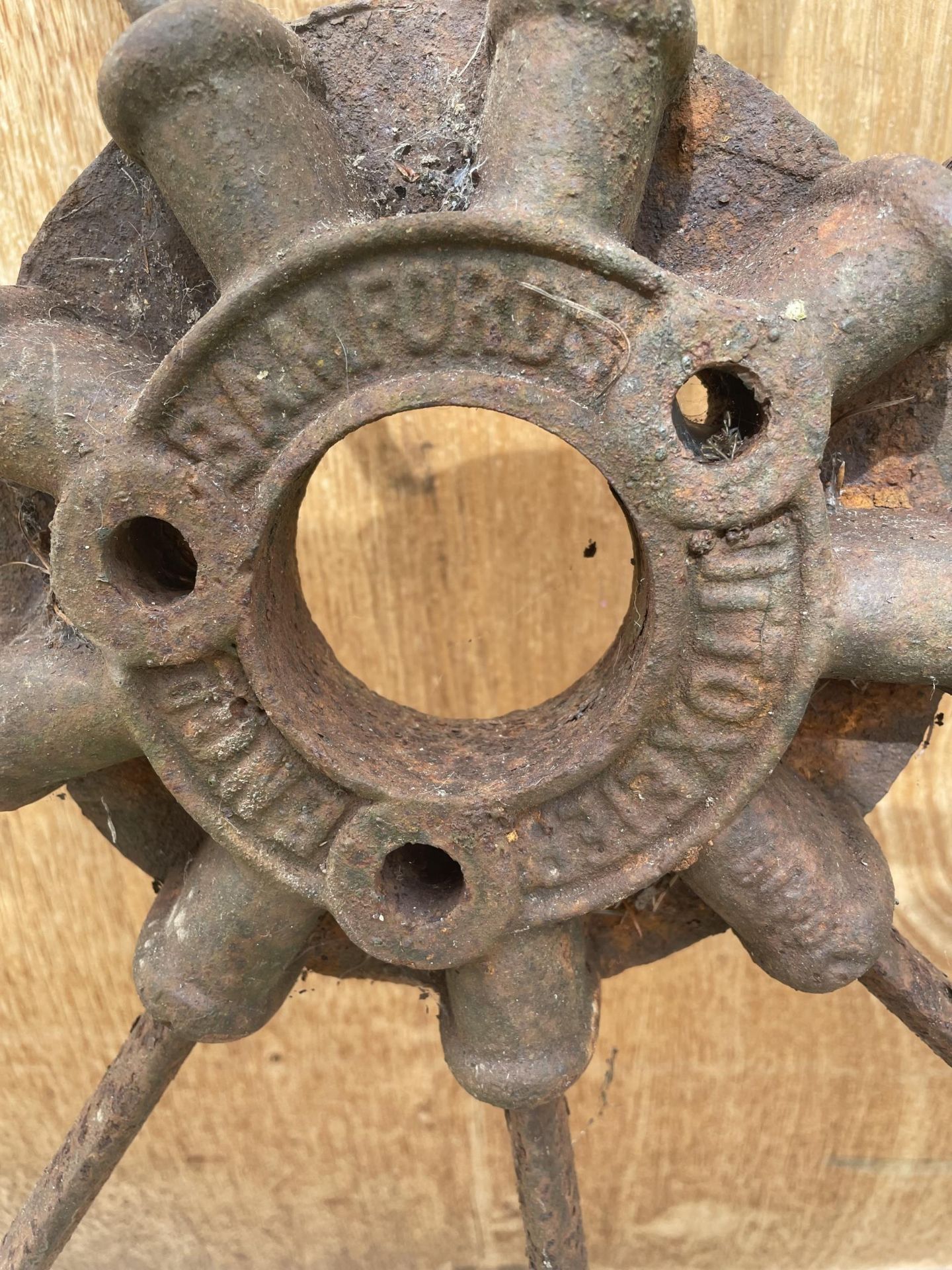 A PAIR OF CAST IRON CART WHEELS WITH NINE SPOKES, STAMPED 'BAMFORDS UTTOXETER' - Image 2 of 2