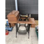 A SINGER TREADLE SEWING MACHINE WITH SEWING CONTENTS TO DRAWERS