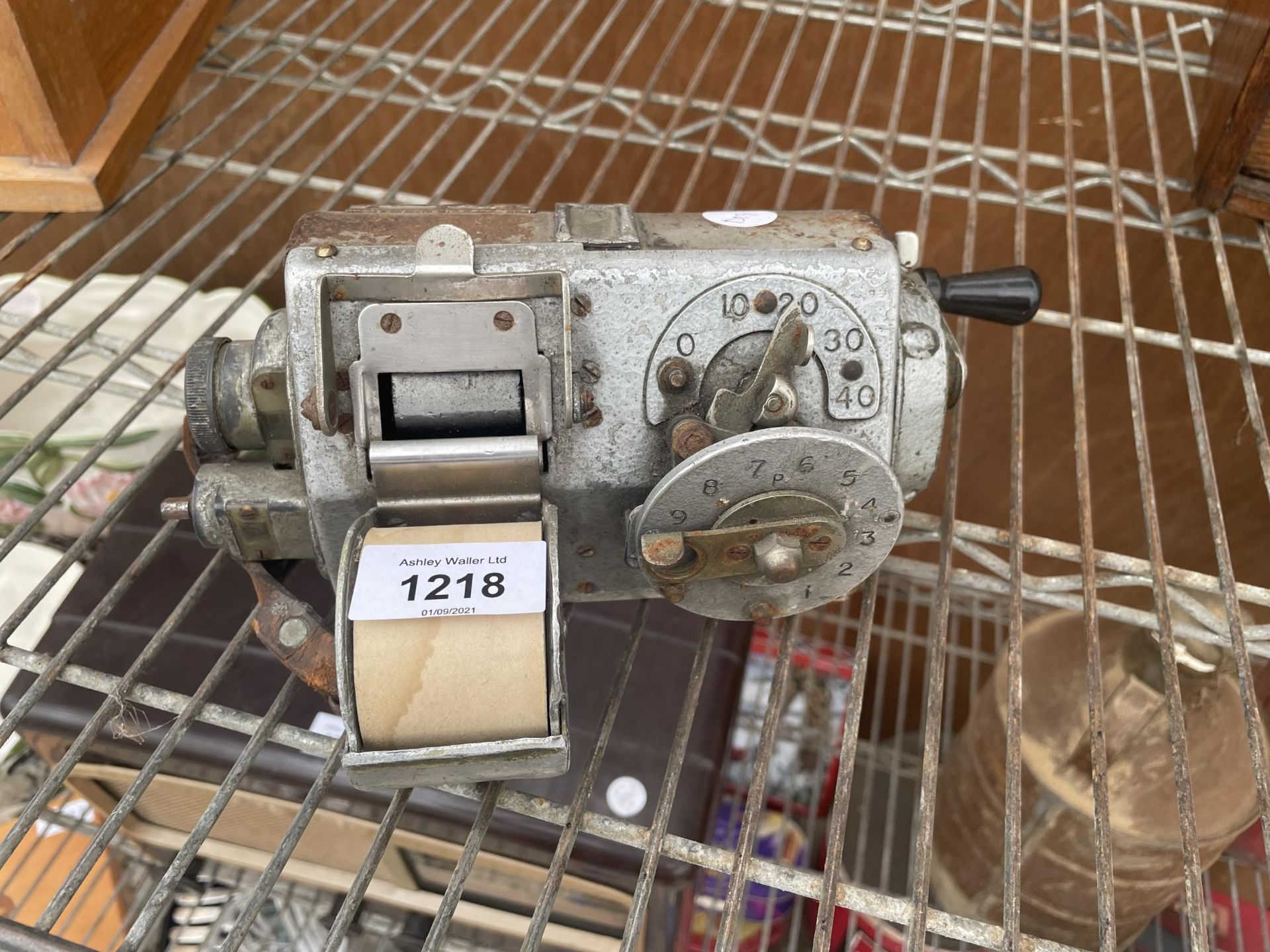 A VINTAGE BUS CONDUCTORS TICKET MACHINE