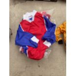 A COLLECTION OF BLUE, RED AND WHITE M.G SPORTSWEAR FOOTBALL TOPS