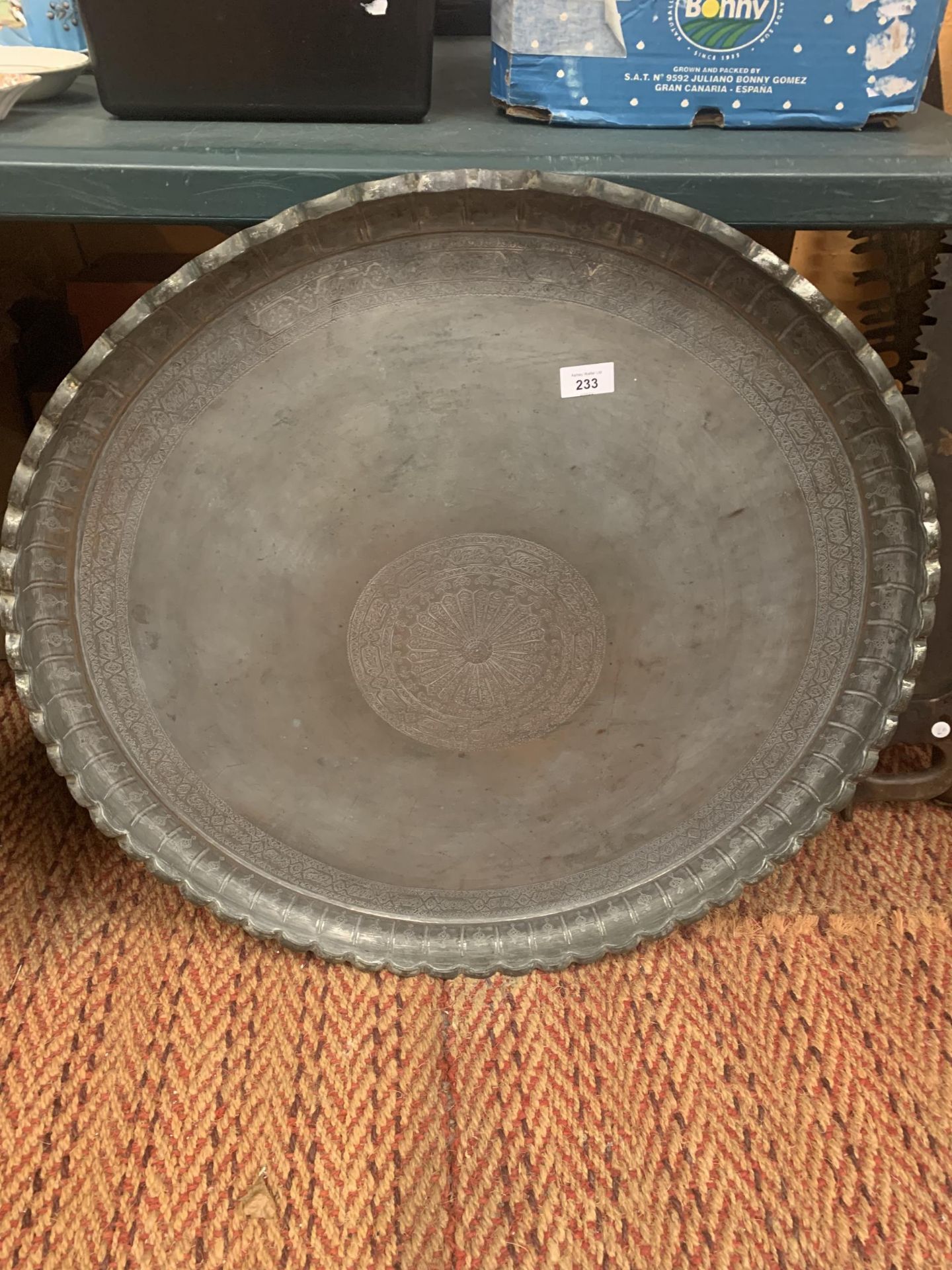 A LARGE INDIAN BRASS CHARGER