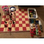 A FOLDING CHESSBOARD , AND BOX OF TOY CARS