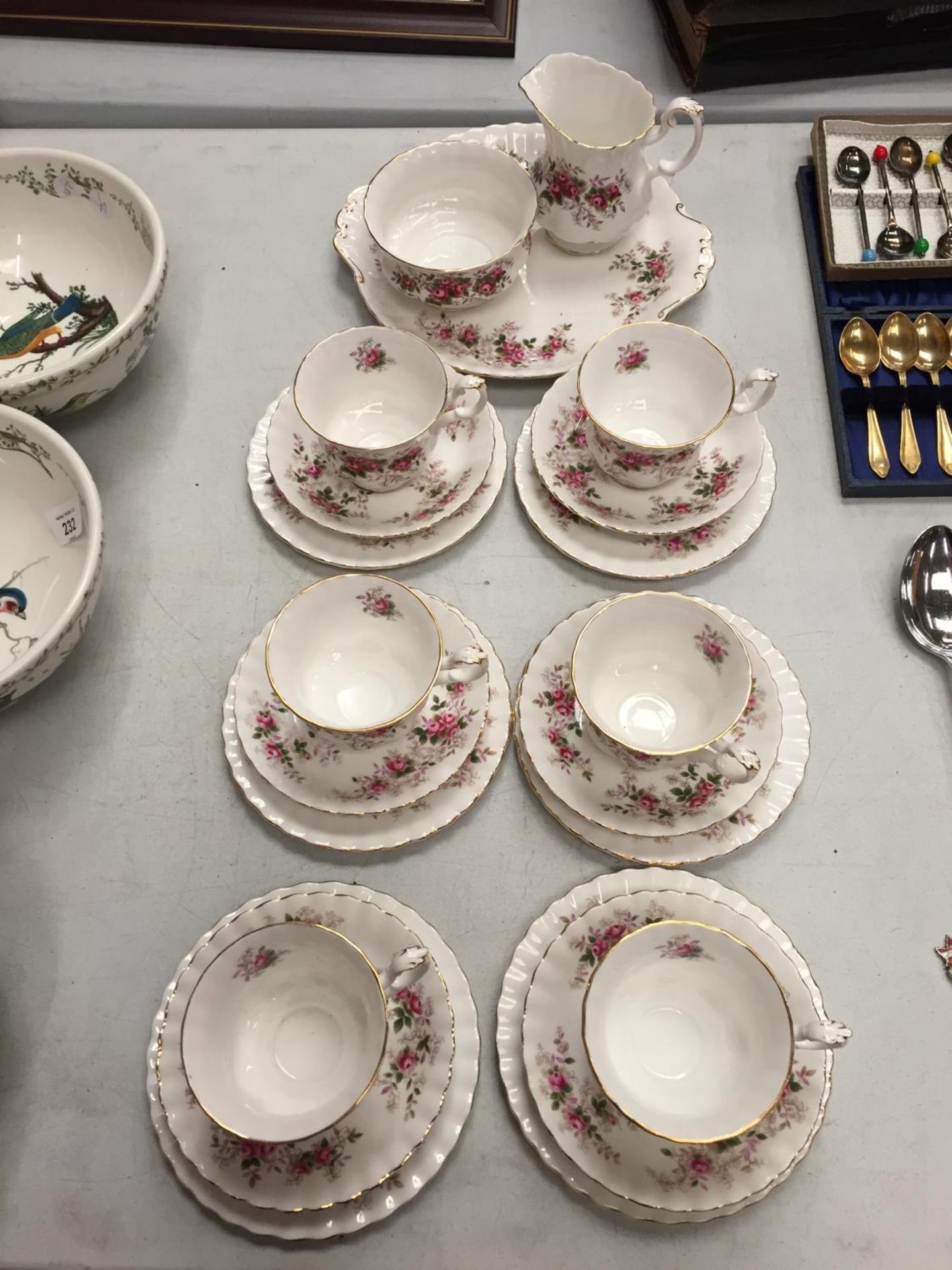 A COLLECTION OF ROYAL ALBERT CHINA "LAVENDER ROSE" TEA CUPS AND SAUCERS , SIDE PLATES, CAKE PLATE,