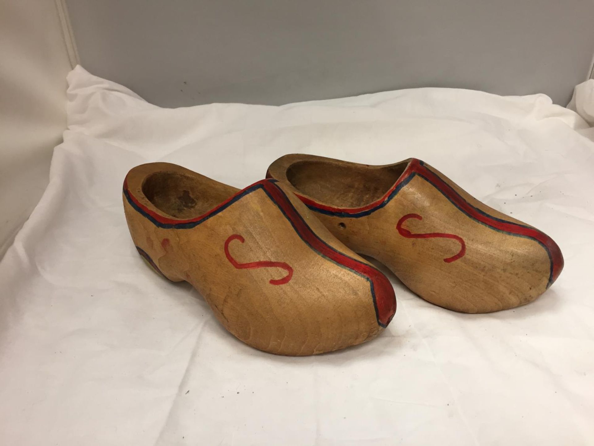 A PAIR OF WOODEN CLOGS