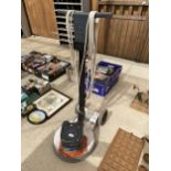 AN ELECTRIC FLOOR POLISHER