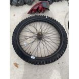 A LARGE THICK TREAD BIKE WHEEL