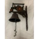 AN OUTDOOR WALL MOUNTED BELL WITH 'JOSEPH BREWER & SONS' TRACTION ENGINE DETAILING