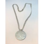 A SILVER LINK NECKLACE WITH A UNITED STATES OF AMERICA TRADE DOLLAR PENDANT