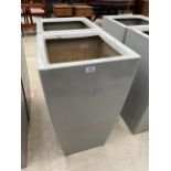 TWO LARGE GREY PLASTIC PLANTERS