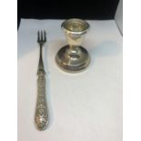 A HALLMARKED BIRMINGHAM CANDLESTICK AND A SILVER PLATED PICKLE FORK