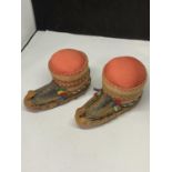 A PAIR OF ASIAN SHOE STYLE PIN CUSHIONS