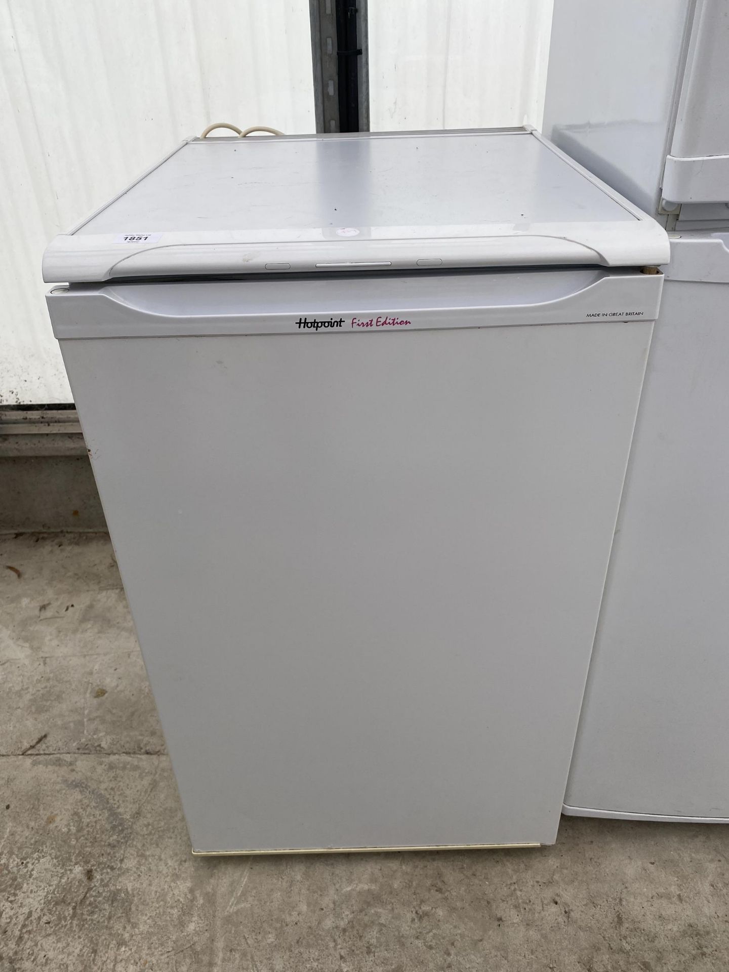 A WHITE HOTPOINT FIRST EDITION UNDERCOUNTER FRIDGE