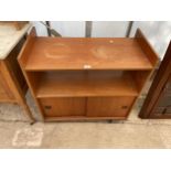 A RETRO TEAK RECORD CABINET WITH SLIDING DOORS AND SHELVES ABOVE, 32" WIDE