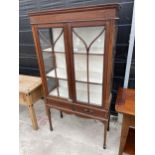 AN EDWARDIAN MAHOGANY AND INLAID TWO DOOR DISPLAY CABINET 36" WIDE