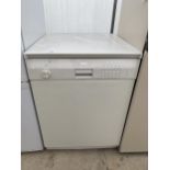 A WHITE CANDY UPRIGHT FRIDGE FREEZER