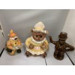 TWO NOVELTY TEAPOTS AND A TEDDY BEAR COOKIE JAR (LID A/F)