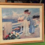 A LARGE FRAMED ALBERT MAIGNAN PRINT OF TWO LADIES TAKING IN THE SEA