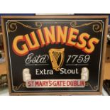 A WOODEN FRAMED GUINESS SIGN 80CM X 64CM