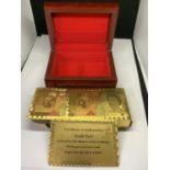 A SET OF 999.9 GOLD PLAYING CARDS IN A PRESENTATION BOX