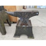 A LARGE VINTAGE ANVIL WITH HEAVY CAST IRON ANVIL STAND