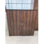 A TWO DOOR STAINED PINE CUPBOARD 49" WIDE