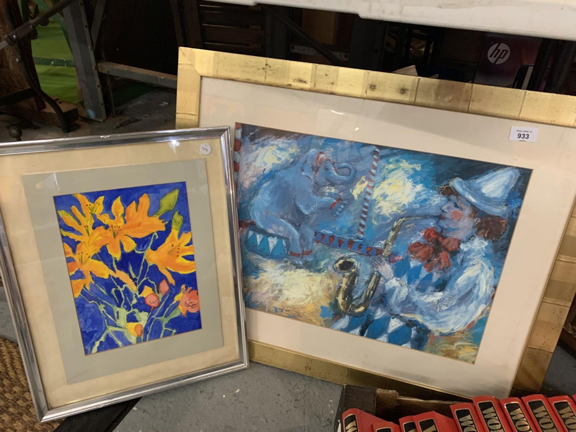 TWO FRAMED PICTURES ONE OF A CLOWN PLAYING THE SAXOPHONE
