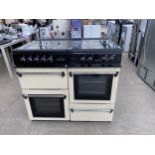 A CREAM AND BLACK LEISURE RANGE COOKER AND HOB