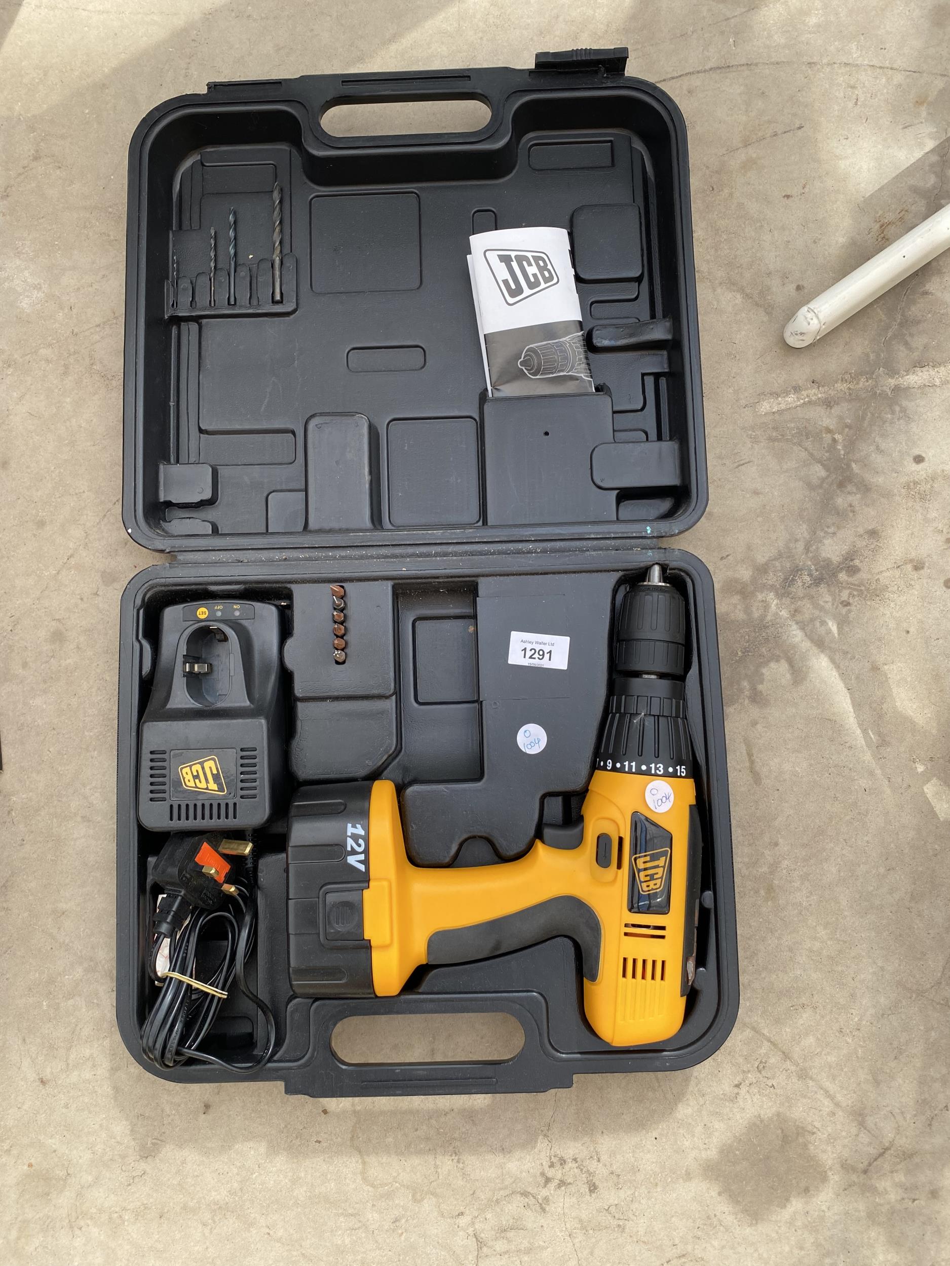 A JCB BATTERY POWERED DRILL IN BOX AND WITH CHARGER