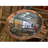 AN OVAL COPPER AND BRASS ART DECO STYLE FRAMED WALL MIRROR, LENGTH 72CM, WIDTH 57CM