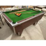A MODERN POOL TABLE 72"X42" WITH SEVEN CUES, BALLS AND
