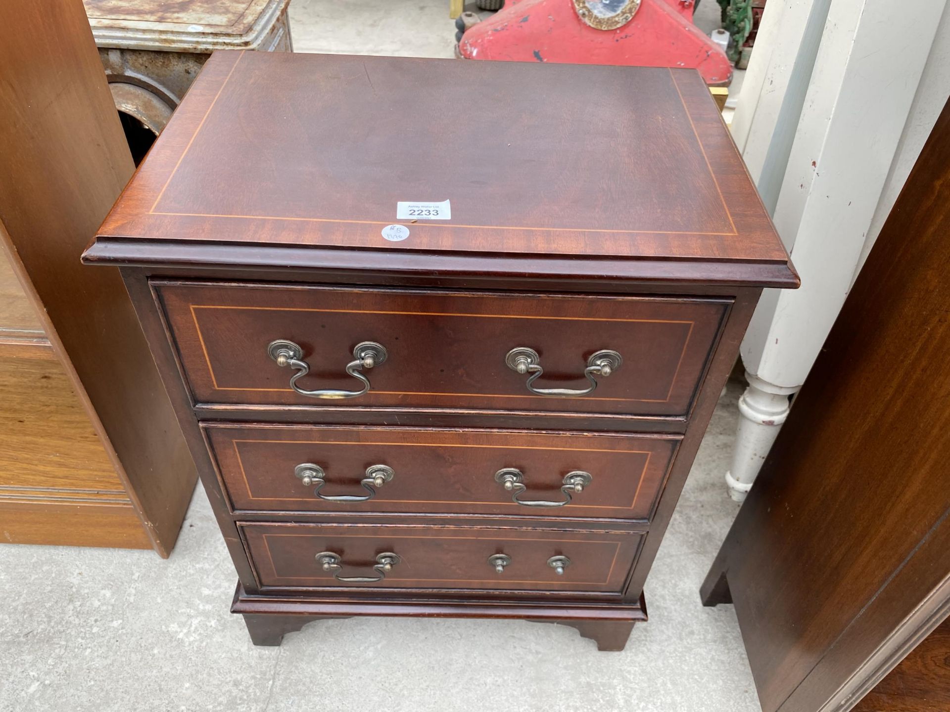 A MAHOGANY AND INLAID CHEST OF THREE DRAWERS 19" WIDE