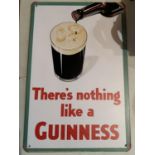A GUINNESS METAL WALL HANGING SIGN