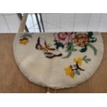 AN OVAL TAPESTRY RUG