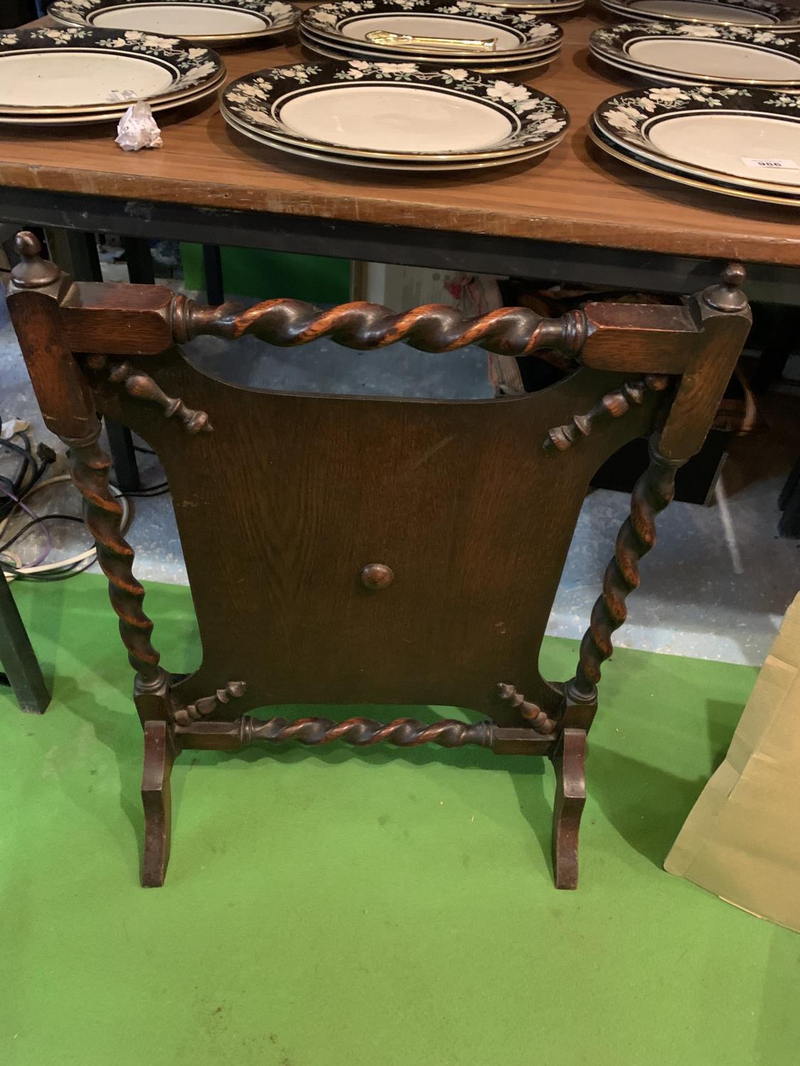 AN OAK FIRESCREEN WITH BARLEY TWIST DETAIL