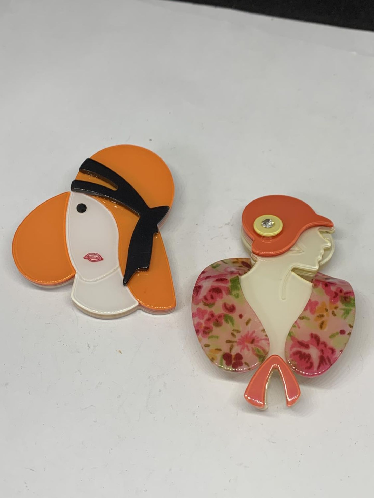 TWO ART DECO STYLE BROOCHES OF ELEGANT LADIES