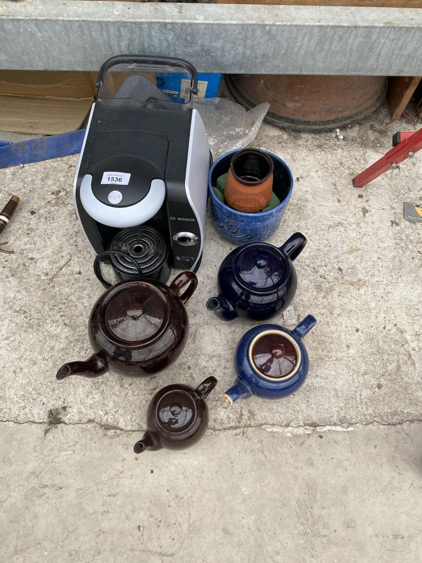 A COFFEE MAKER AND VARIOUS TEAPOTS