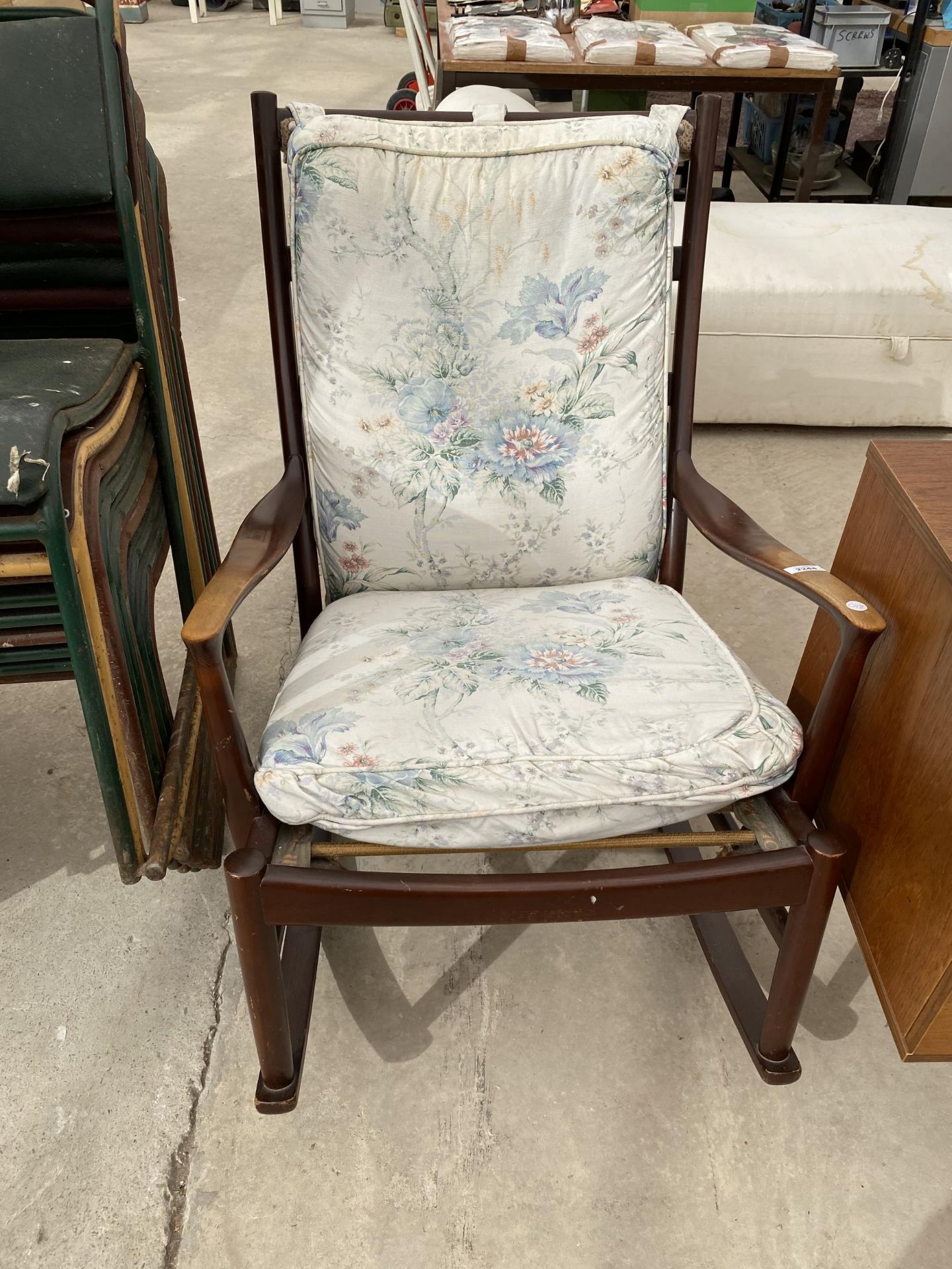 A PARKER KNOLL ROCKING CHAIR - NUMBER PK 1016/7/8/9