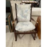 A PARKER KNOLL ROCKING CHAIR - NUMBER PK 1016/7/8/9