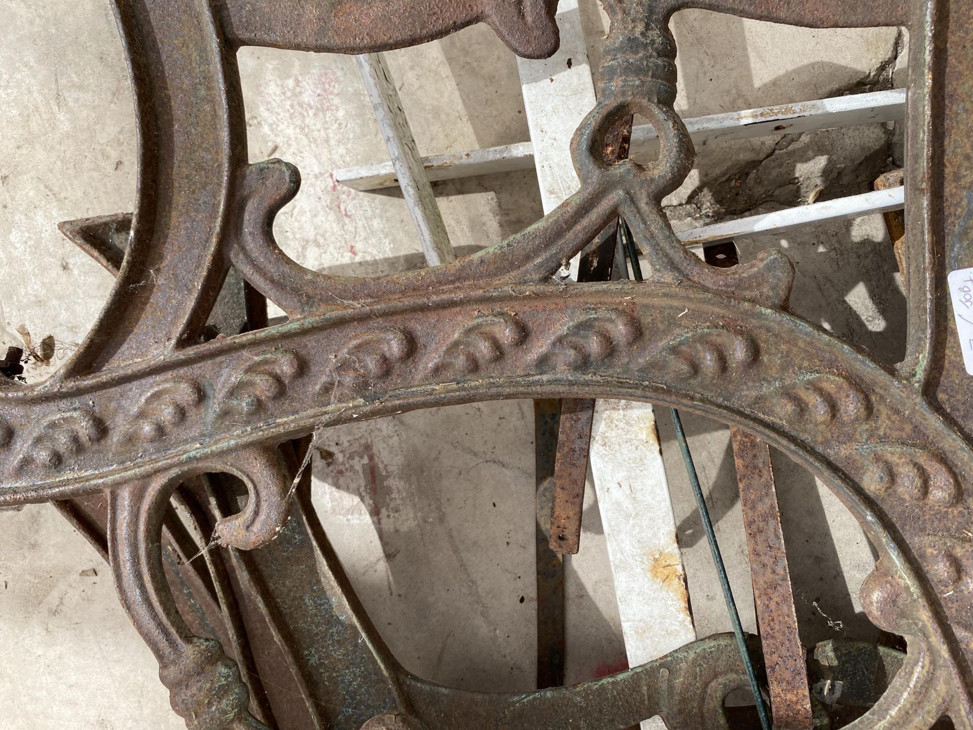 FOUR VARIOUS CAST BENCH ENDS AND TWO WROUGHT IRON FRAMES - Image 2 of 2