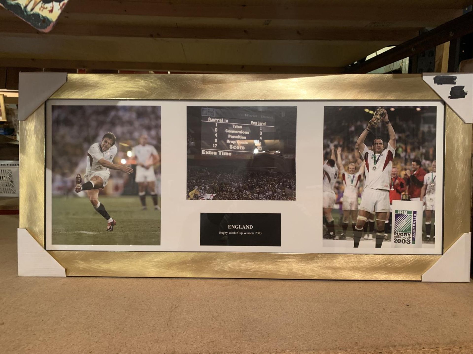 A FRAMED PRINT OF RUGBY WORLD CUP WINNERS 2003
