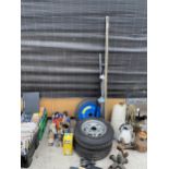 AN ASSORTMENT OF ITEMS TO INCLUDE CAR WHEELS, JACKS AND OIL CANS ETC