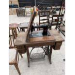 A SINGER TREADLE SEWING MACHINE