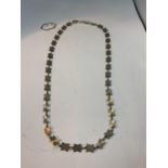 A SILVER STAR NECKLACE 18 INCHES LONG
