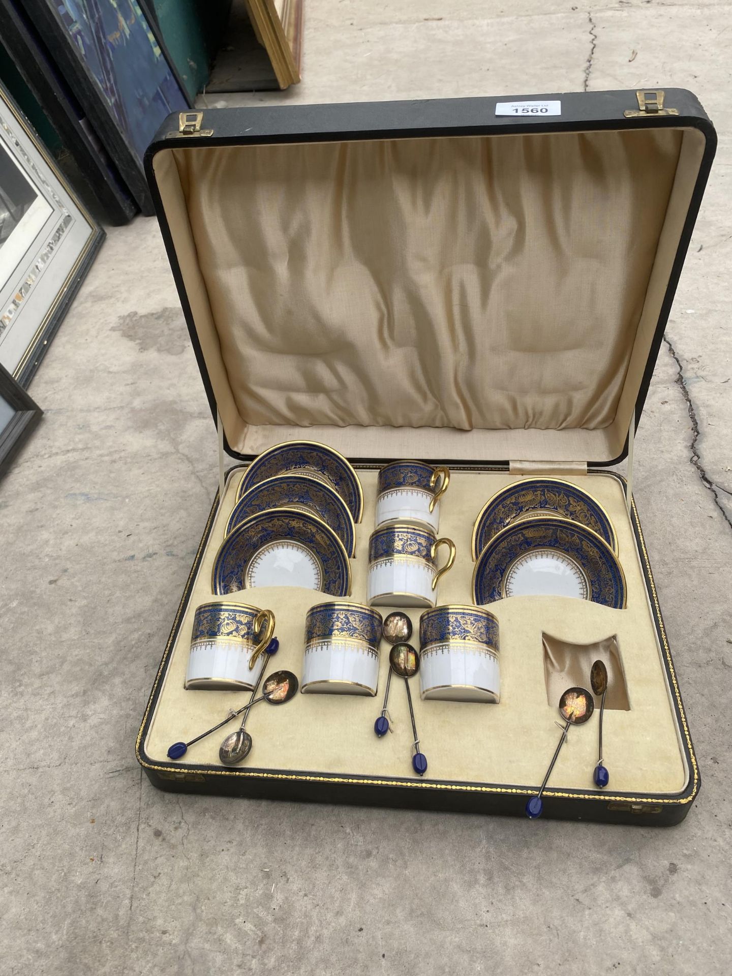 A CASED SIX PIECE COFFEE SET WITH SIX HALLMARKED SILVER COFFEE BEAN SPOONS (ONE CUP AND SAUCER