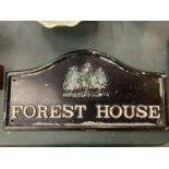 A CAST IRON SIGN "FOREST HOUSE "