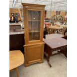 A MODERN LIGHT OAK CORNER CUPBOARD WITH GLAZED AND LEADED UPPER PORTION, 27" WIDE