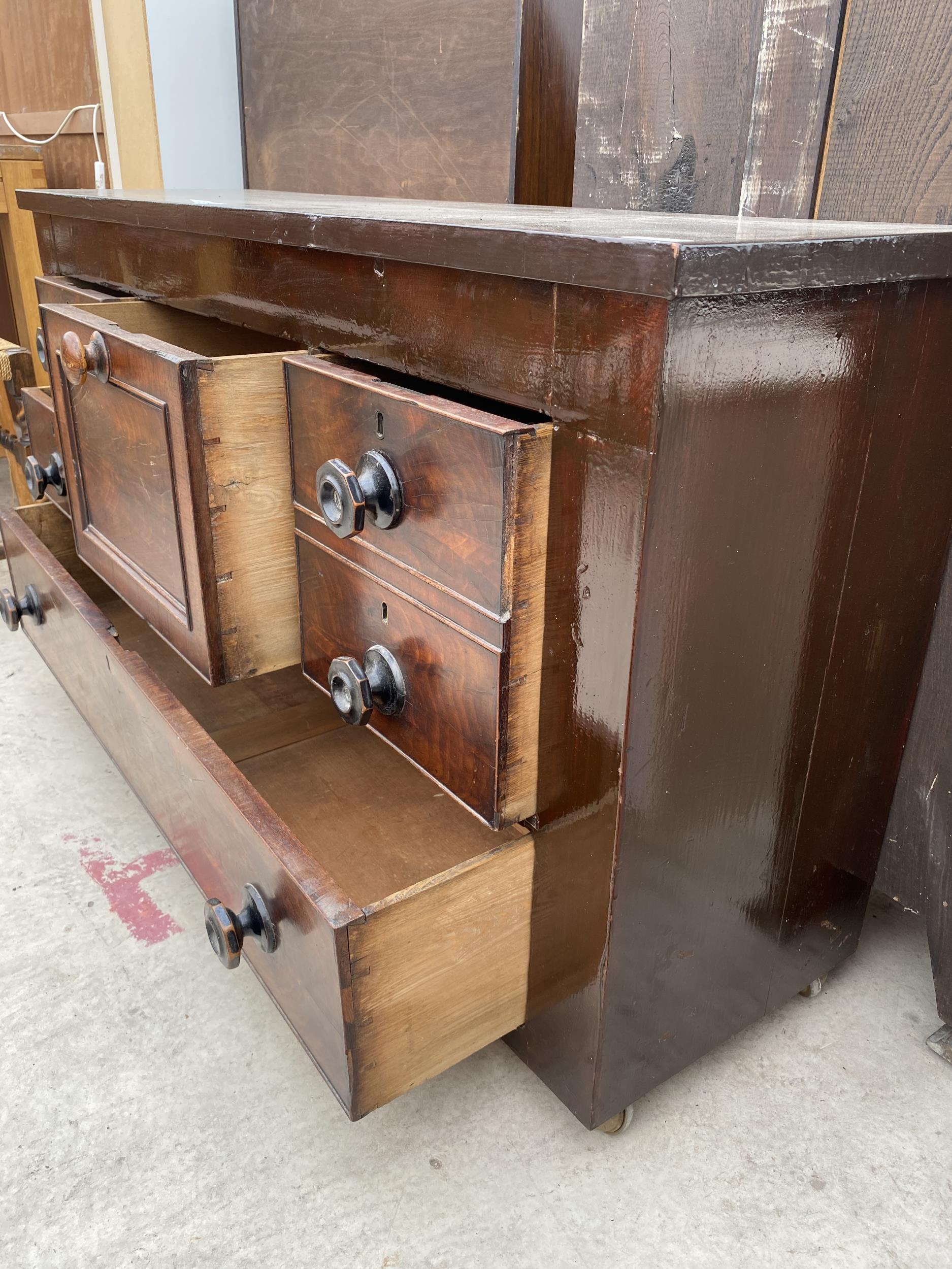 A MAINLY 19TH CENTURY MAHOGANY CHEST OF FOUR SHORT AND ONE LONG DRAWER AND A CENTRAL TOP HAT - Image 4 of 4